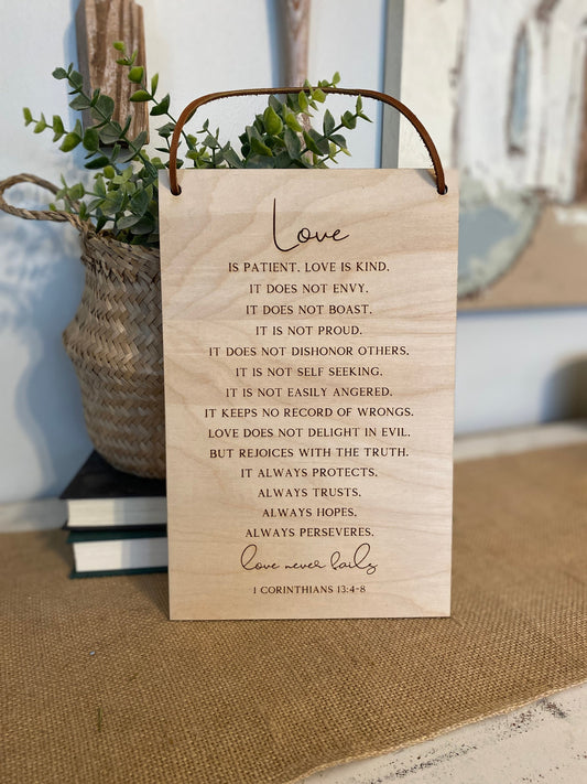Love Never Fails Wood Wall Hanging